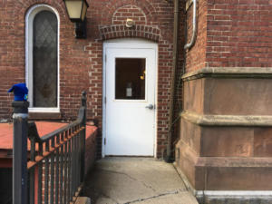 door at end of wheelchair ramp at old town hall.